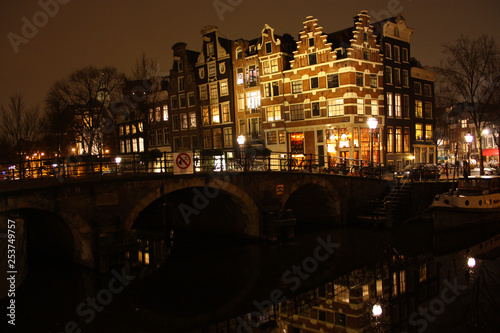 famous bridge in amsterdam. romantic night landscape. a bit of haze and fog makes the magic channel