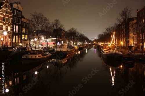 famous bridge in amsterdam. romantic night landscape. a bit of haze and fog makes the magic channel