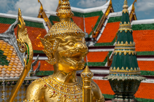 Golden Guardian Statue in the Temple of the Emerald Buddha Wat Phra Kaew in Bangkok Thailand. © GISTEL