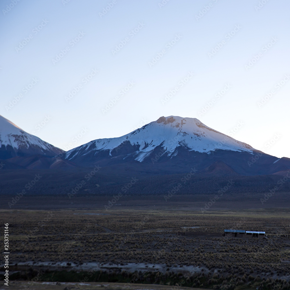 Sunset in Andes. Parinacota volcano. High Andean landscape in the Andes.