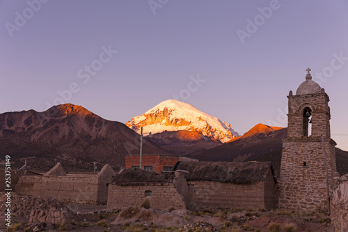 Dusk in the small Andean town of Sajama  with the Sajama volcano in the background. Bolivian Altiplano. Bolivia