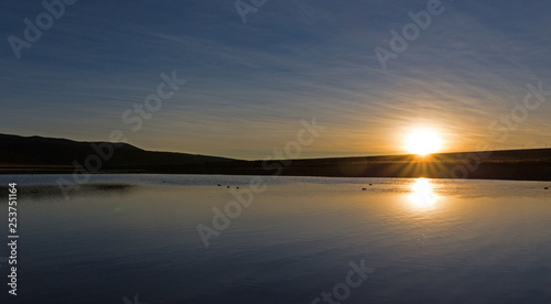 Sunset in Andes. lagoon Huayacota. High Andean landscape in the Andes.