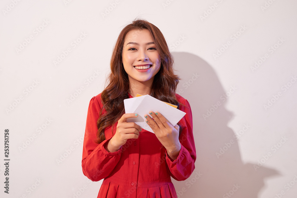 Lovely female with red heart isolated on gray background, celebration of Valentine day, romantic feelings, harmony and love concept Lovely female with red heart isolated on gray background, celebration of Valentine day, romantic feelings, harmony and love concept