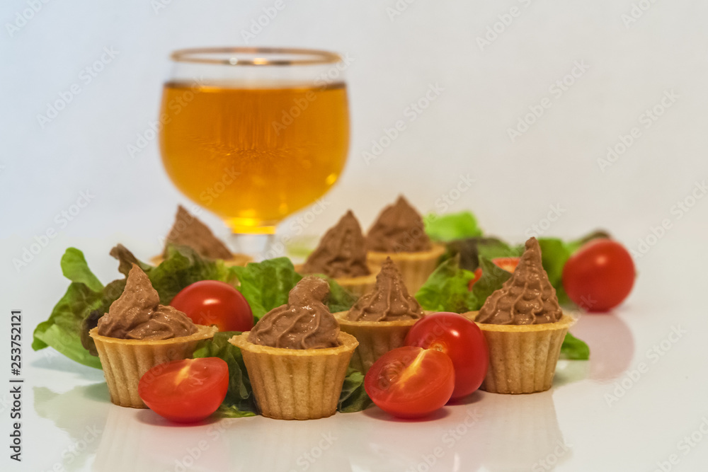 tartlets with liver pate decorated with lettuce and cherry tomatoes