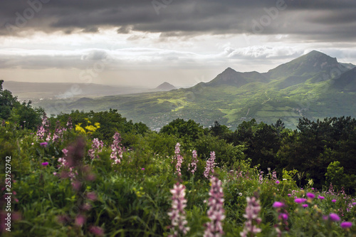 landscape of green mountains at sunset