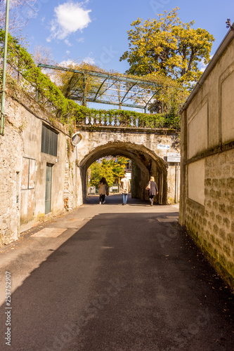 Italy  Bellagio  Lake Como  a path with trees on the side of a building