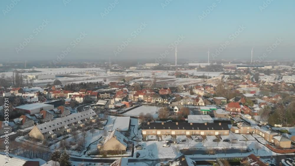 Drone flying over village covered with snow Drone flying over village covered with snow