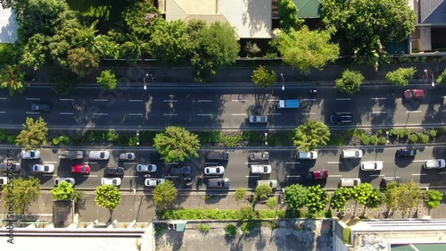 Drone shot of city traffic on a bright day photo