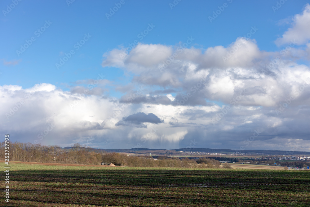 Green fields and blue skies over hessen in Germany