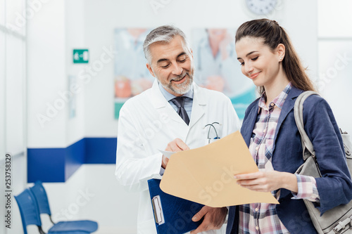 Doctor explaining medical records to his patient