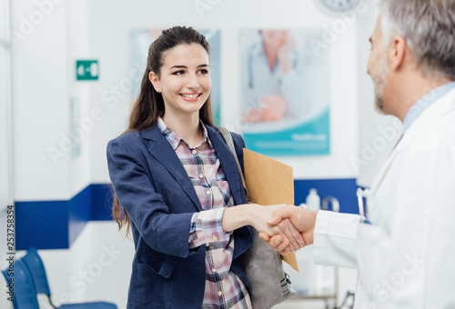 Woman meeting the doctor and shaking hands