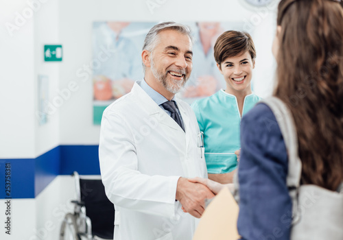 Fototapeta Naklejka Na Ścianę i Meble -  Doctor welcoming a patient at the clinic