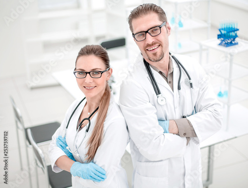 portrait of two young scientists on the background of the laboratory
