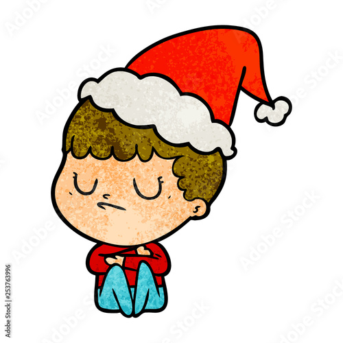 textured cartoon of a grumpy boy wearing santa hat