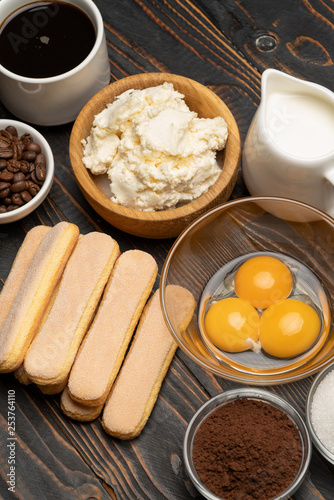 Ingredients for cooking tiramisu Savoiardi biscuit cookies, mascarpone, cream, sugar, cocoa, coffee and egg