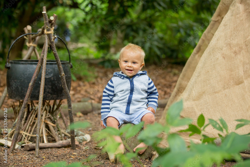 Beautiful children, siblings, camping in the forest Beautiful children, siblings, camping in the forest