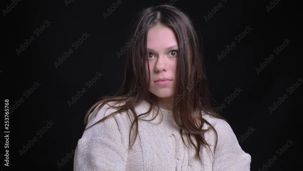 Closeup shoot of young attractive caucasian female making different facial expressions and posing in front of the camera with joy Closeup shoot of young attractive caucasian female making different facial expressions and posing in front of the camera with joy