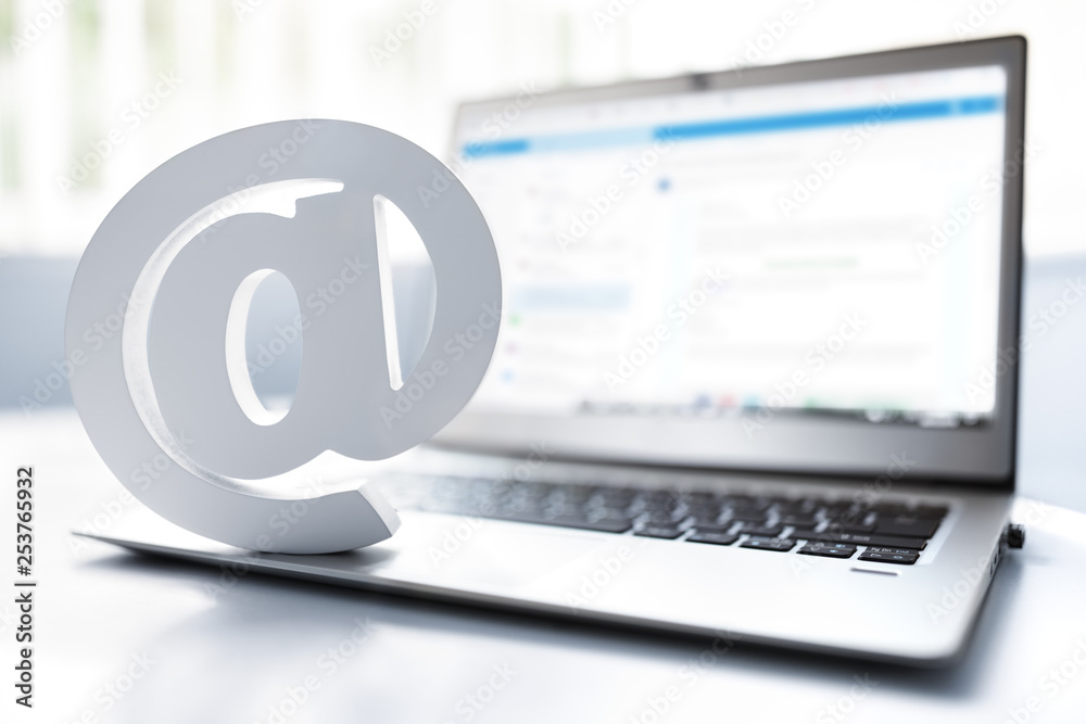 Email symbol on business laptop computer Email symbol on business laptop computer