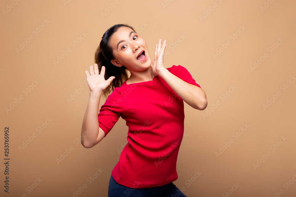 Portrait of excited woman isolated over background Portrait of excited woman isolated over background