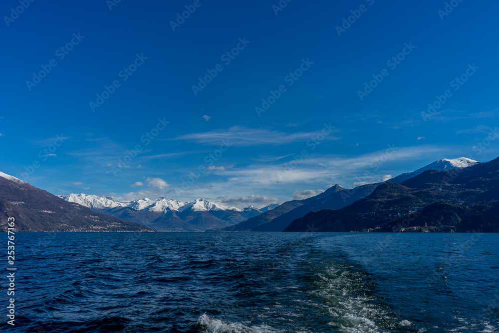 Italy, Bellagio, Lake Como with snow covered peaks background