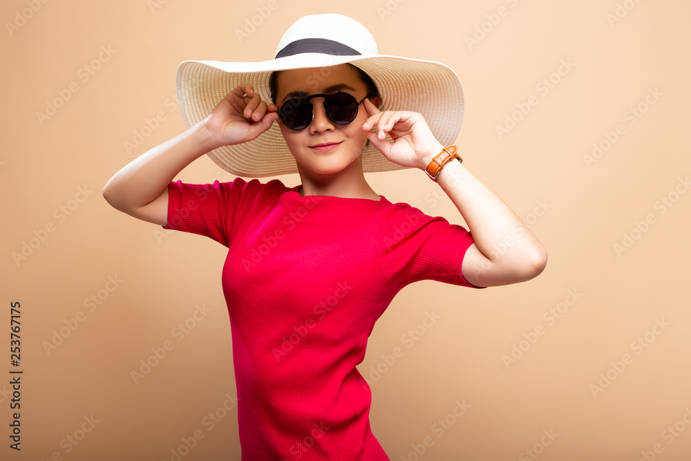 Portrait woman wearing big hat isolated on brown beige background Portrait woman wearing big hat isolated on brown beige background