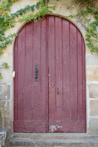 antique wooden door in a stone wall