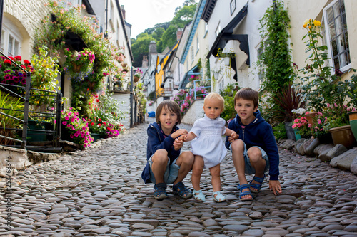 Beautiful family, walking on the streets of Clovelly, nice old village in the heart of Devonshire