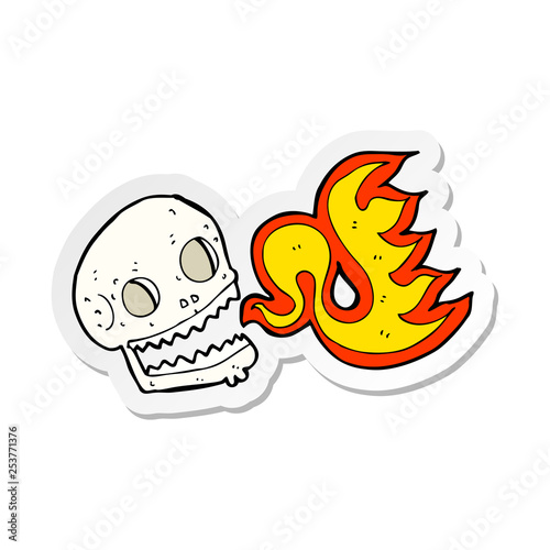 sticker of a cartoon flaming skull