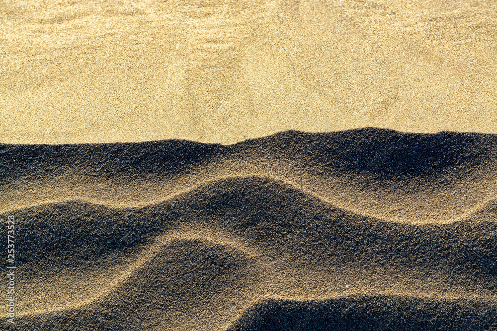 Background with sandy dune waves texture close up, copy space