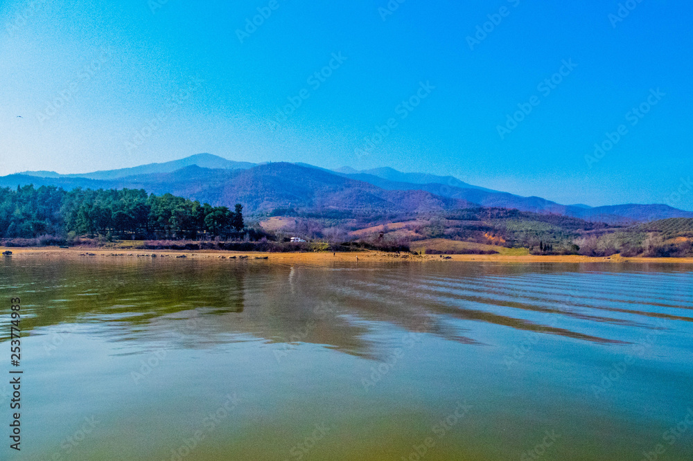 A beautiful lake and mountains in the background,in a small town in Greece Kerkini which is famous for its big lake