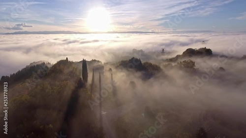 drone flying over foggy mediterranean landscape with beautiful wineries