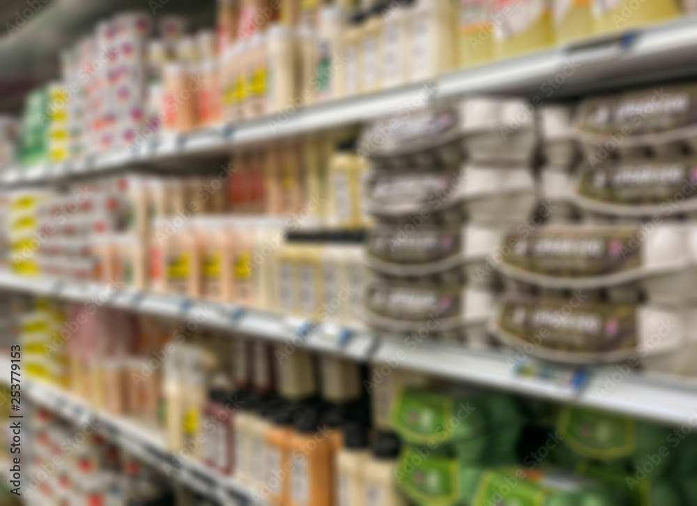 blurred background with supermarket shelves of dairy products