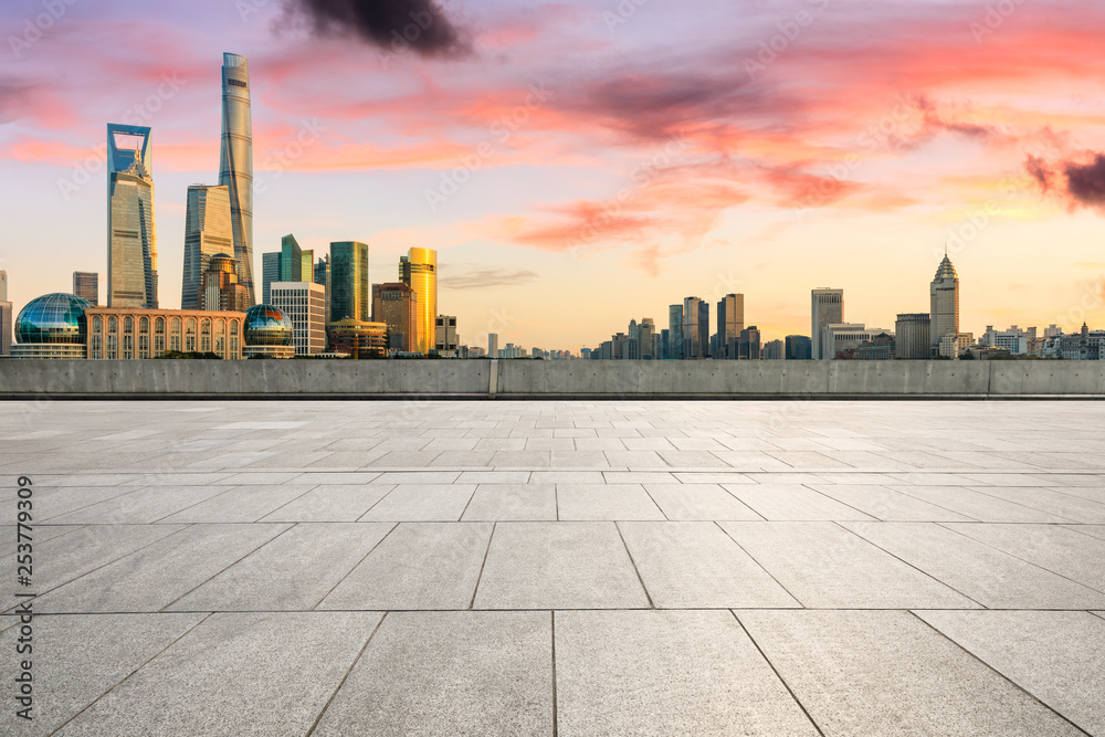 Empty square floor and modern city buildings in Shanghai at dusk Empty square floor and modern city buildings in Shanghai at dusk