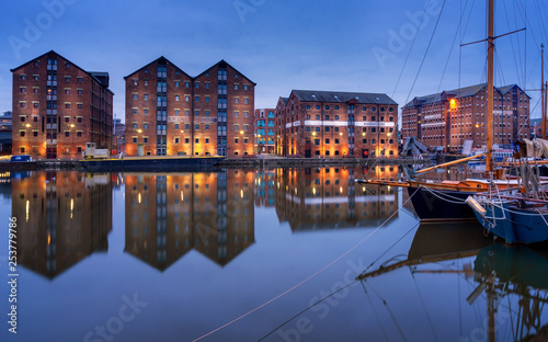 Gloucester docks and sail boats reflected in quay on Sharpness canal