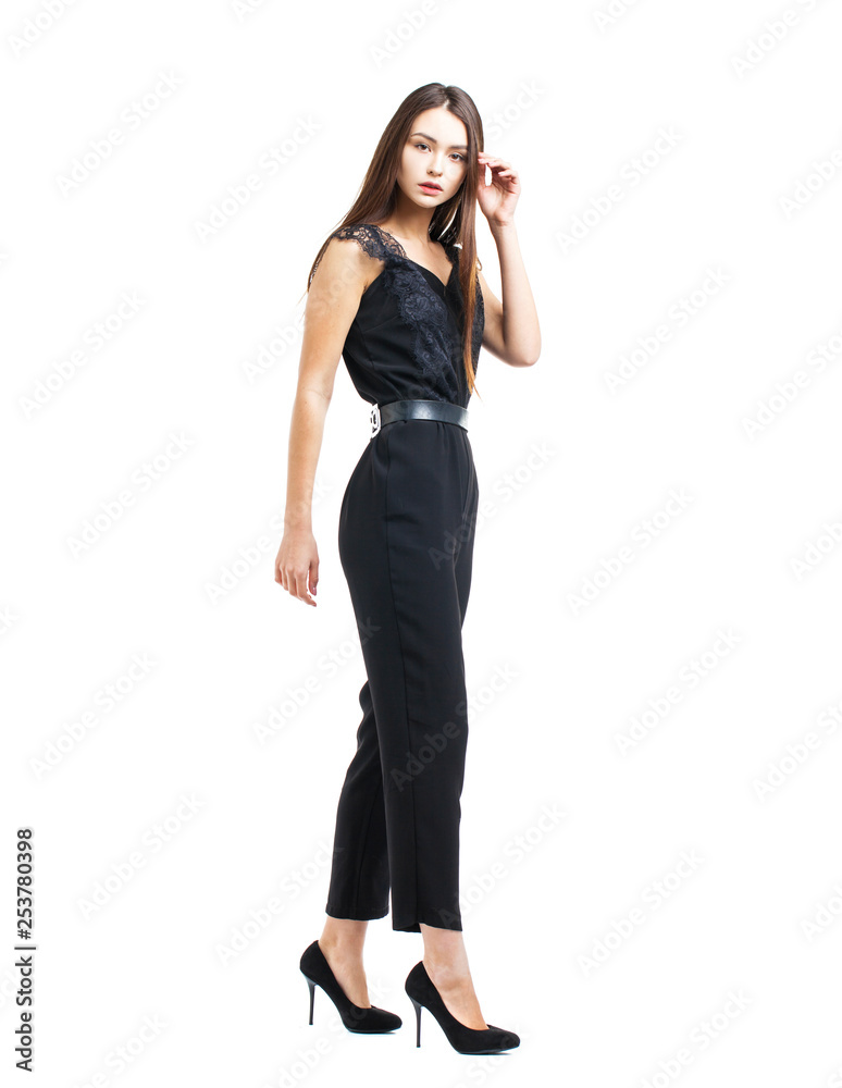 Full body, beautiful brunette woman in a black blouse and pants Full body, beautiful brunette woman in a black blouse and pants
