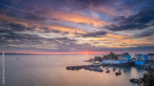 Tenby Harbour at sunrise with spectacular sky