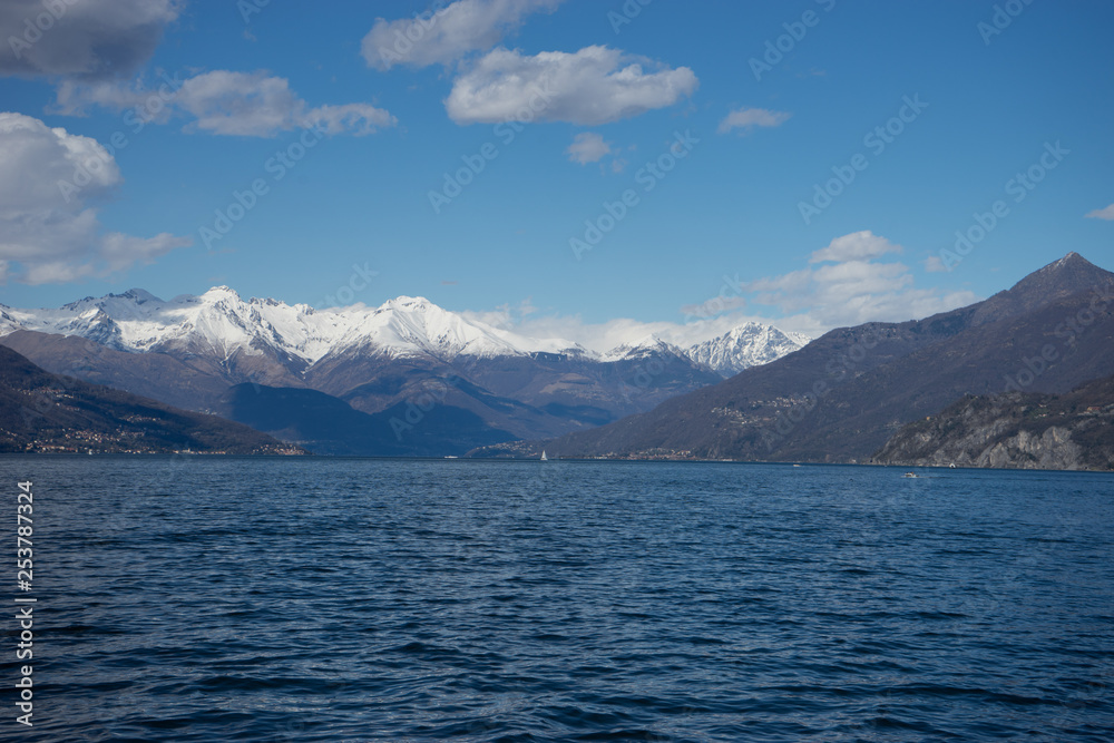 Italy, Lecco, Lake Como, SCENIC VIEW OF SNOWCAPPED MOUNTAINS AGAINST BLUE SKY, Lombardy