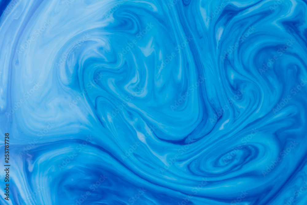 Blue liquid ink swirl abstract background