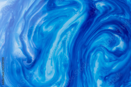Blue liquid ink swirl abstract background