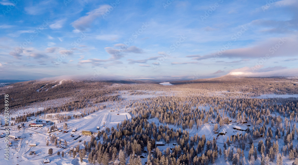Aerial panorama of Idre Fjall, Sweden with the mountains and frozen forest during a cold winter sunrise. Aerial panorama of Idre Fjall, Sweden with the mountains and frozen forest during a cold winter sunrise.