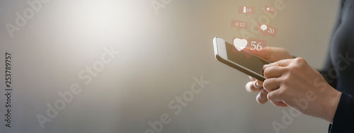 Woman hand using smart phone for social media and ecommerce concept
