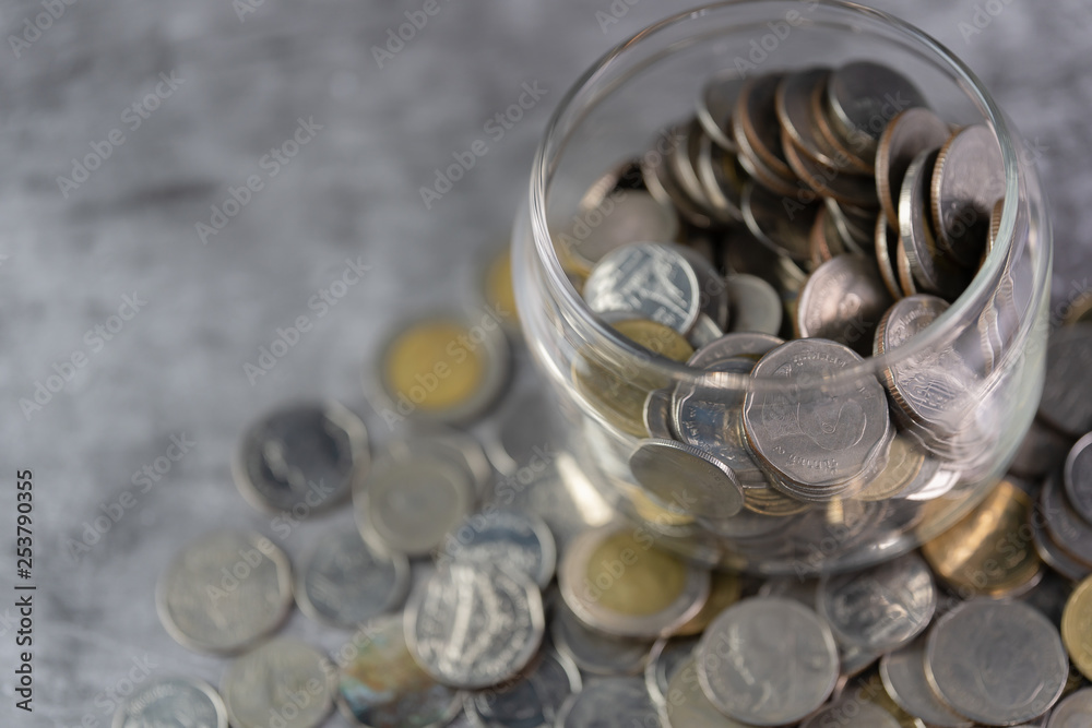 Coins in a glass jar Savings and investment savings Coins in a glass jar Savings and investment savings