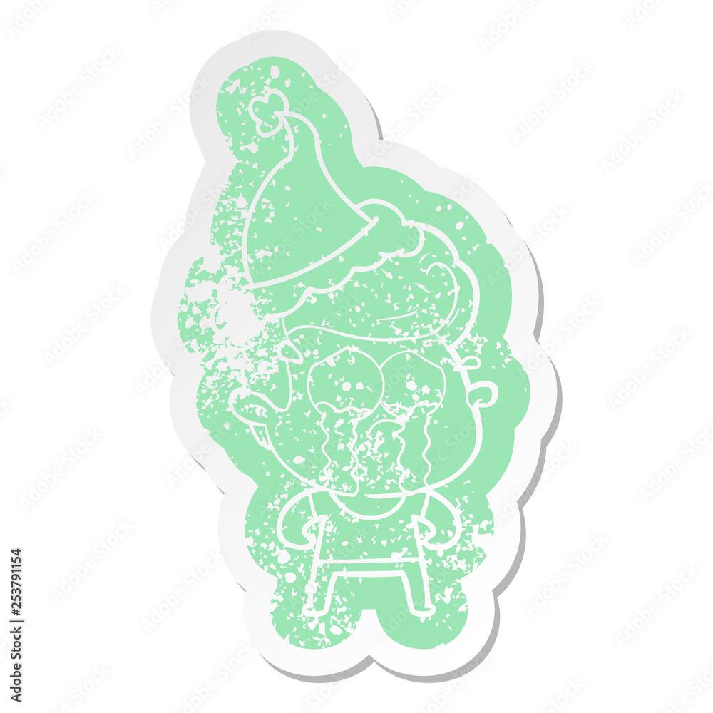 cartoon distressed sticker of a crying man wearing santa hat cartoon distressed sticker of a crying man wearing santa hat