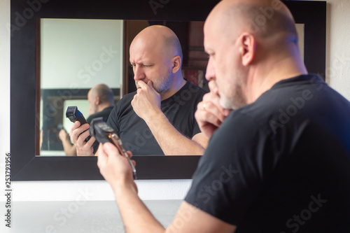 A man looks at the machine ...