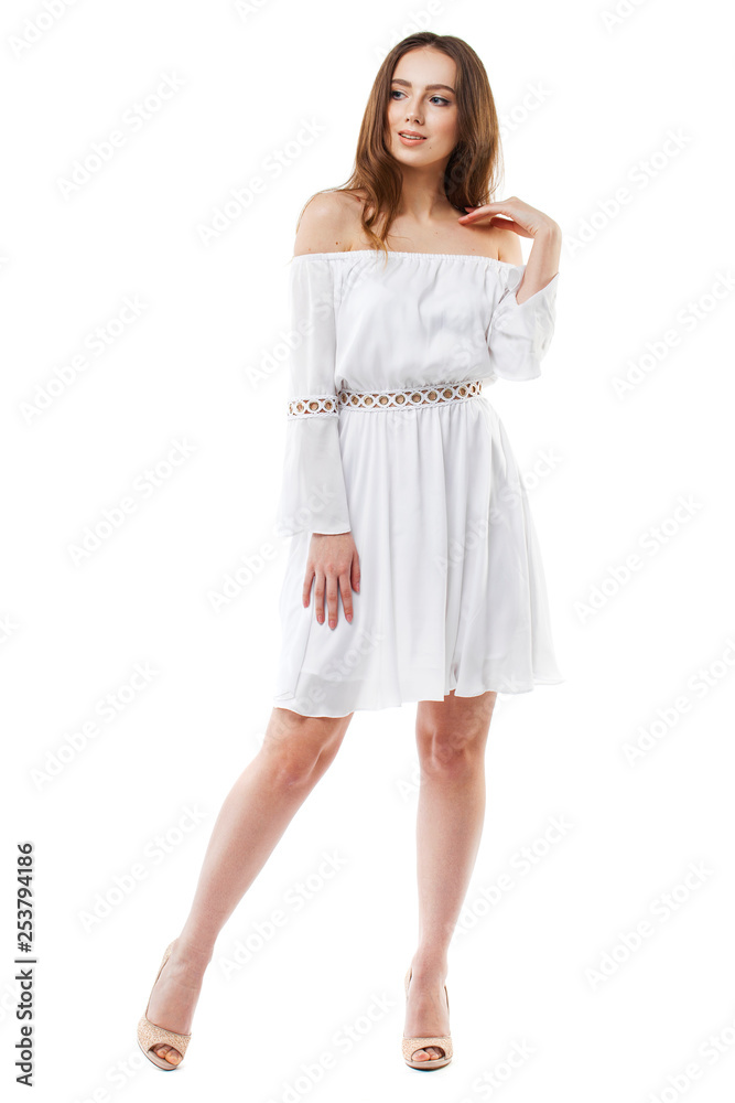 Portrait of a full length young brunette woman in white dress Portrait of a full length young brunette woman in white dress