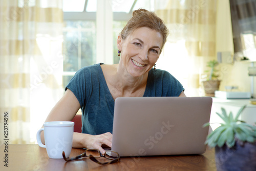 Woman working on laptop in home office