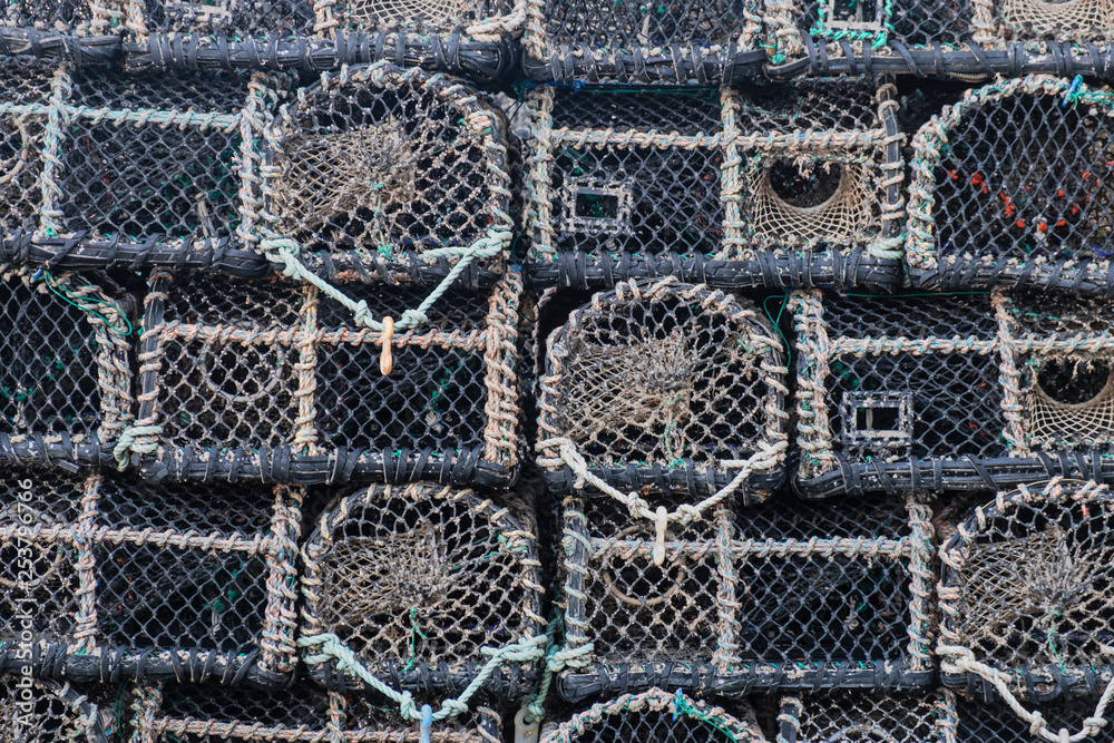 Detail of shellfish traps stacked on an English quayside Detail of shellfish traps stacked on an English quayside