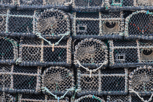 Detail of shellfish traps stacked on an English quayside