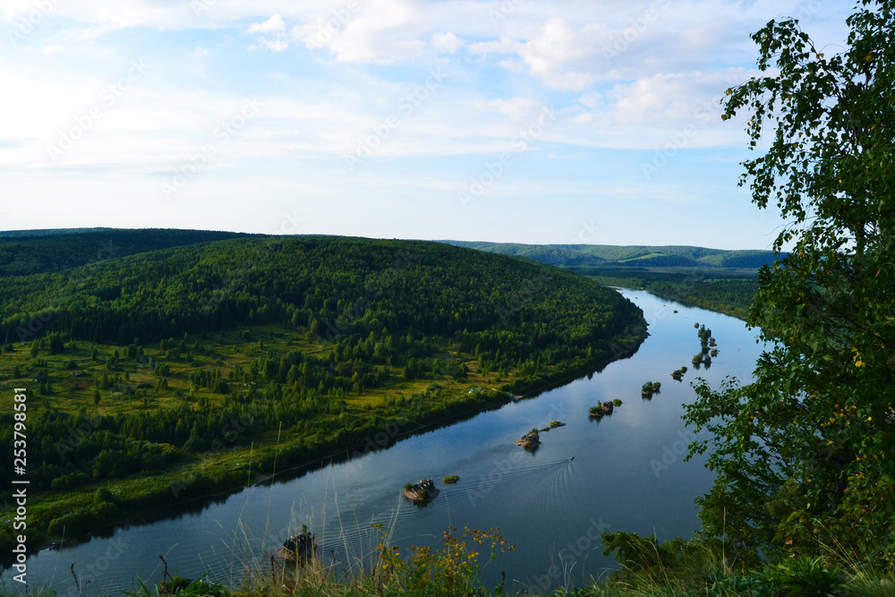 a bend of the river on a background of mountains with a bird's eye view