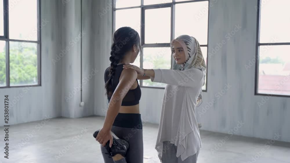 woman hijab doing sports activities with her friends at the gym
